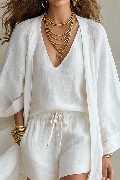 SIRA MONTERO | Conjunto de tres piezas de lino: top, short y cárdigan - Azul marino