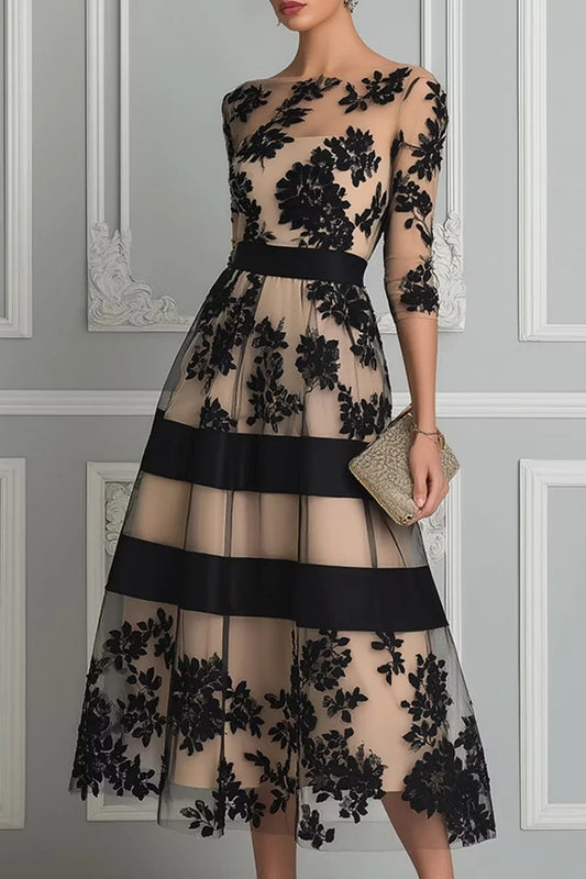 Vestido midi de encaje floral y tul negro de Sira Montero